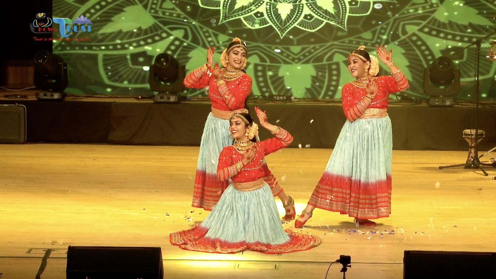 Two dancers on stage with the LED wall behind